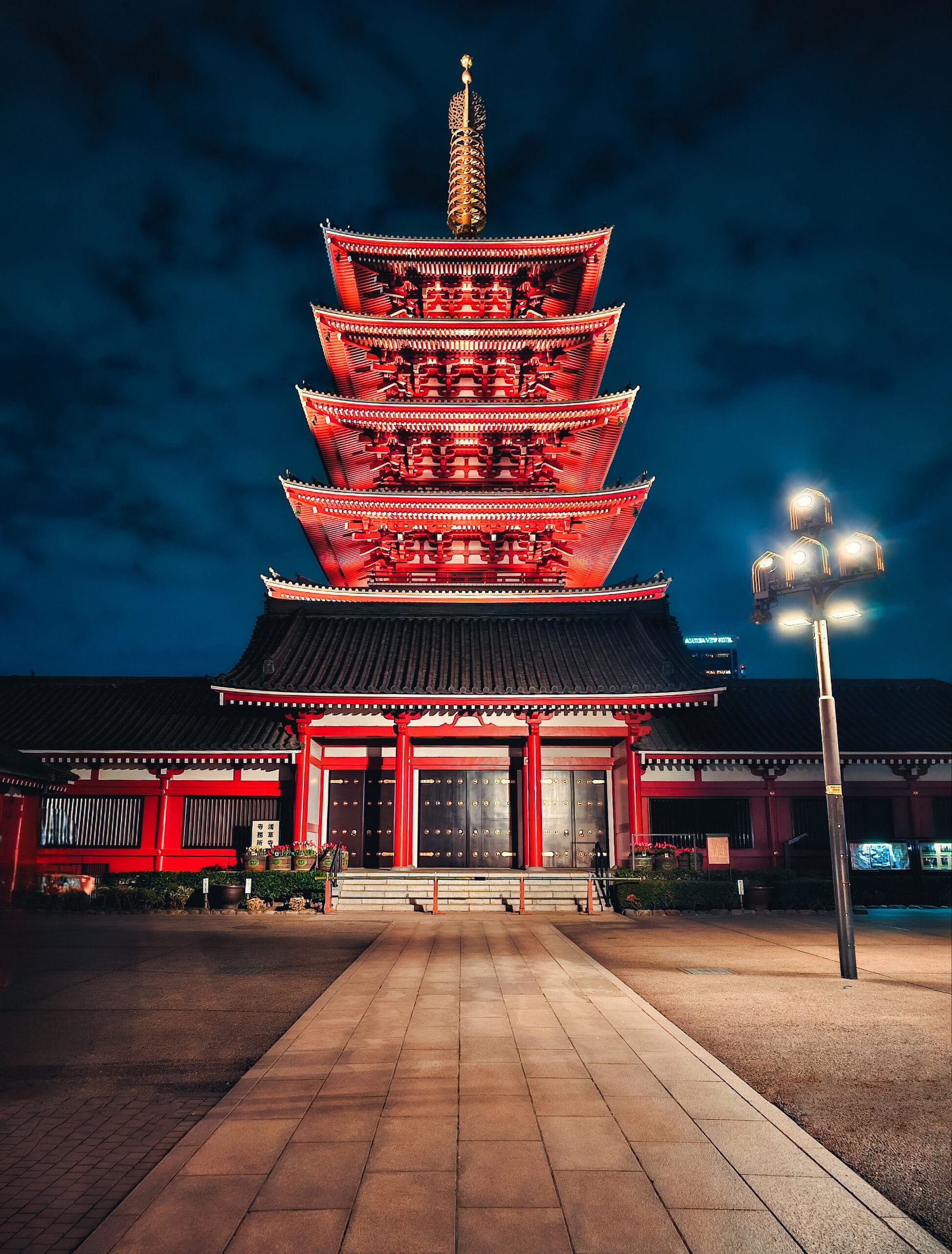 Illuminated Senso-ji Temple and Pagoda at night - MaherTech Inc (saas platform)