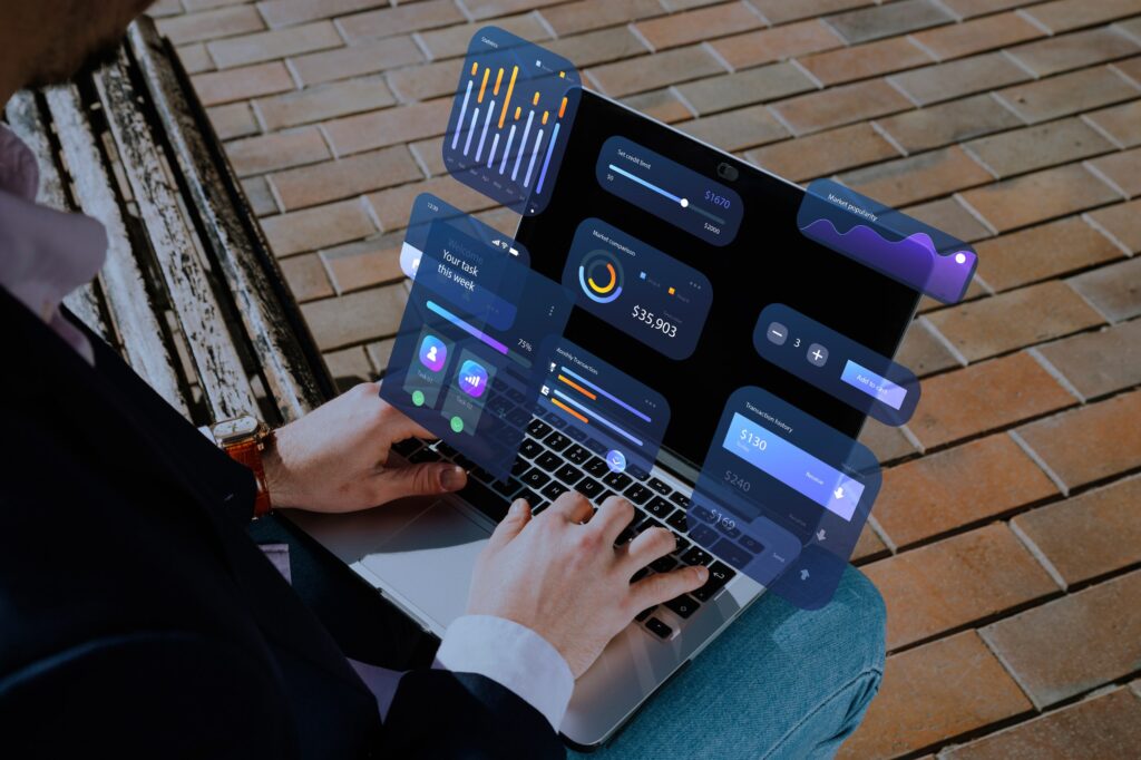Person using laptop with holographic data visualizations - MaherTech Inc (Animation)